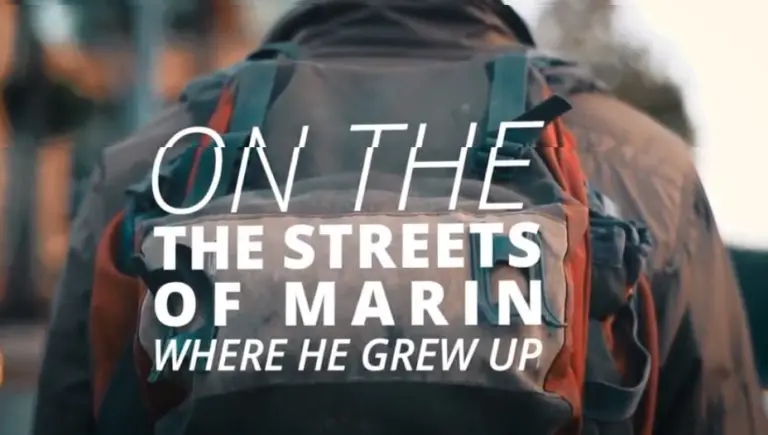 a man wearing a backpack with overlaying text, "on the streets of Marin. where he grew up."