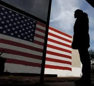 Veteran stands by flag