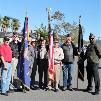Veterans carrying flags gather as color guard for groundbreaking ceremony