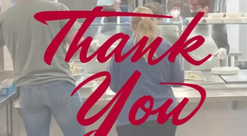 people being served in a cafeteria kitchen with the words 'Thank You'