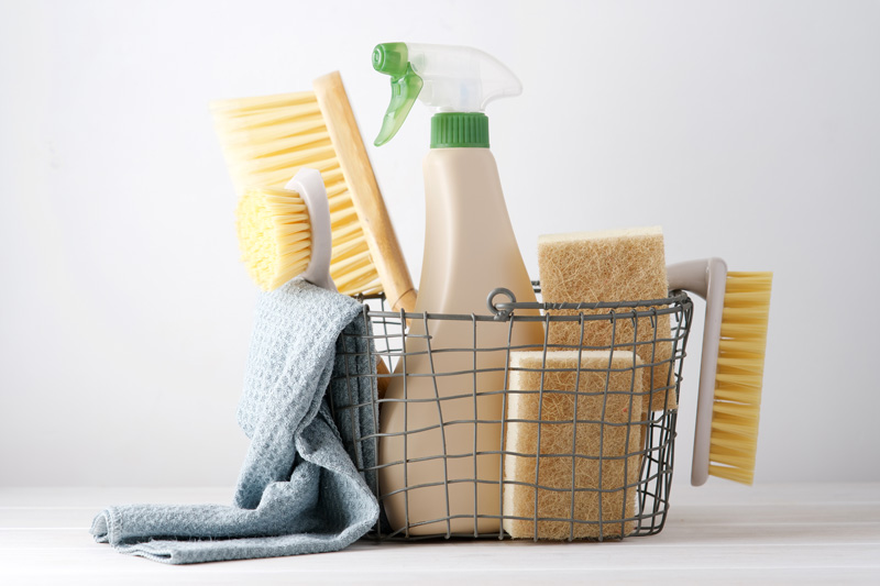a basket of cleaning supplies