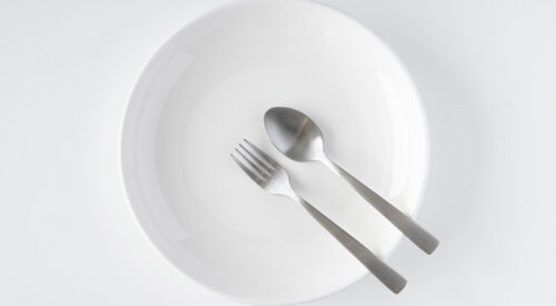 a plate with a fork and spoon