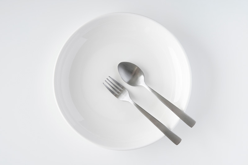 a plate with a fork and spoon
