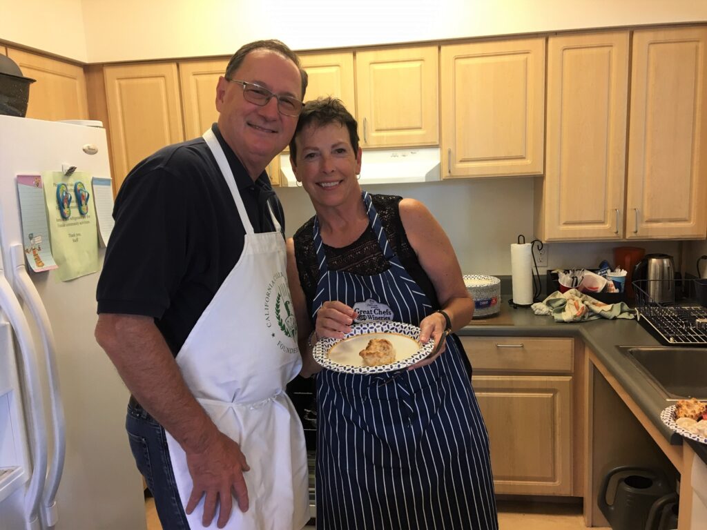 Sharon and Jim smiling in the kitchen