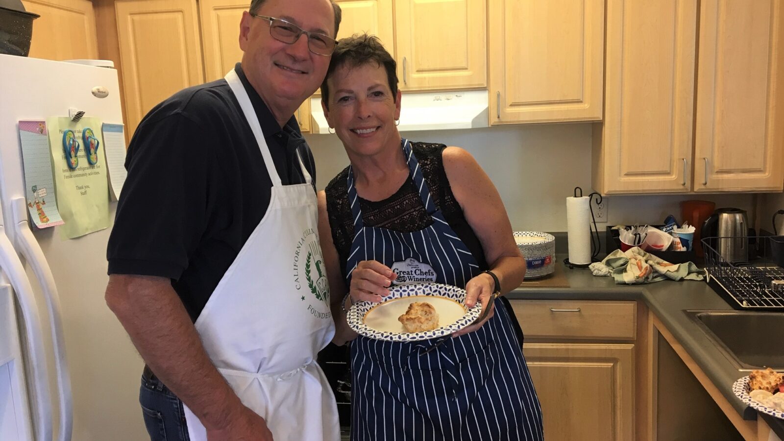 Sharon and Jim smiling in the kitchen
