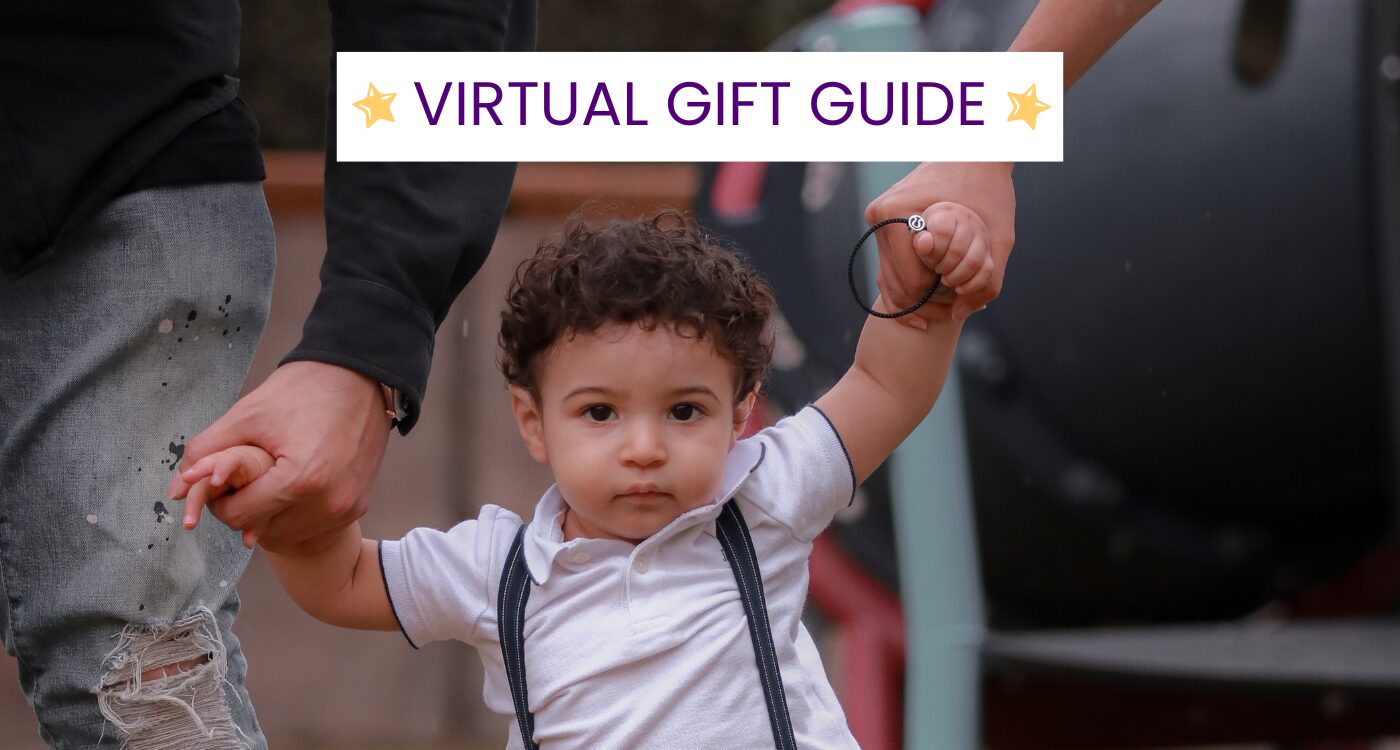 Photo of toddler with curly hair walking with parents